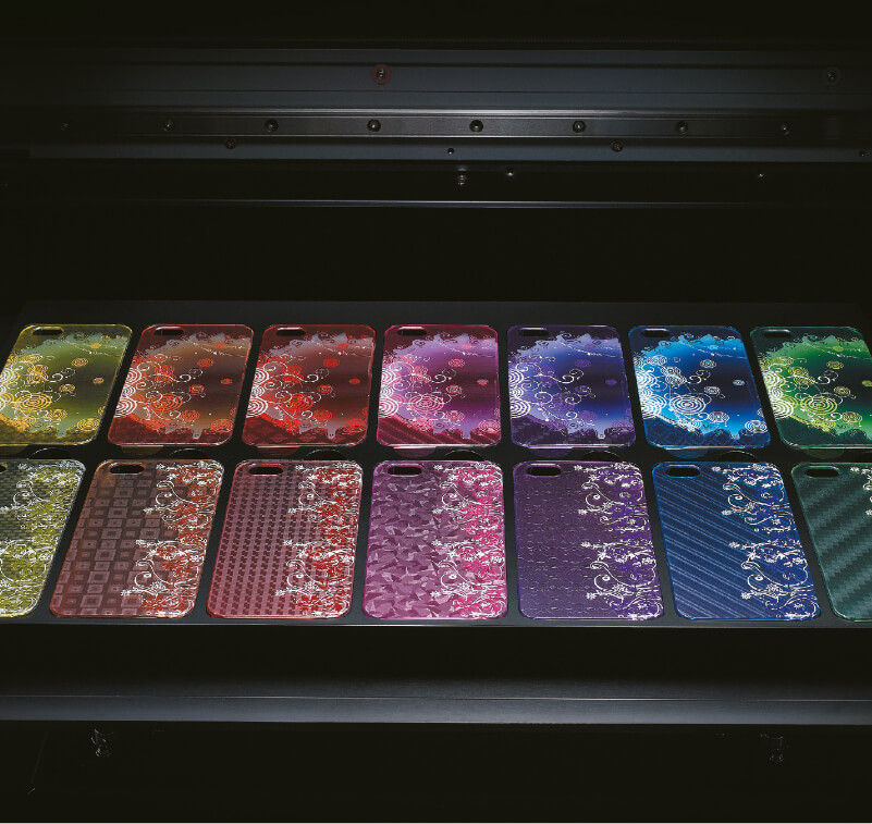 Multicoloured custom phone cases in a UV printer