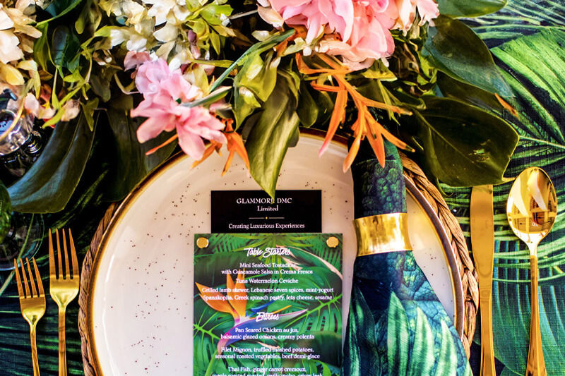 Banner image with bird of paradise-themed menu direct-printed on acrylic and tropical background graphics.