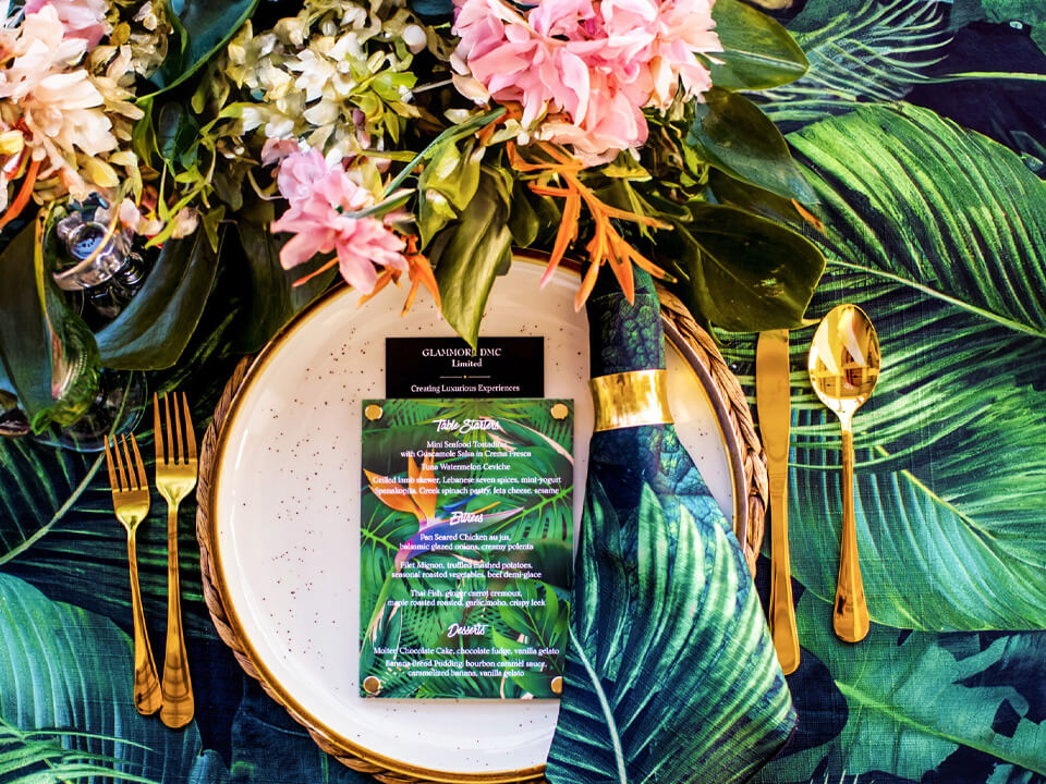 Bird of paradise themed acrylic menu with tropical background.