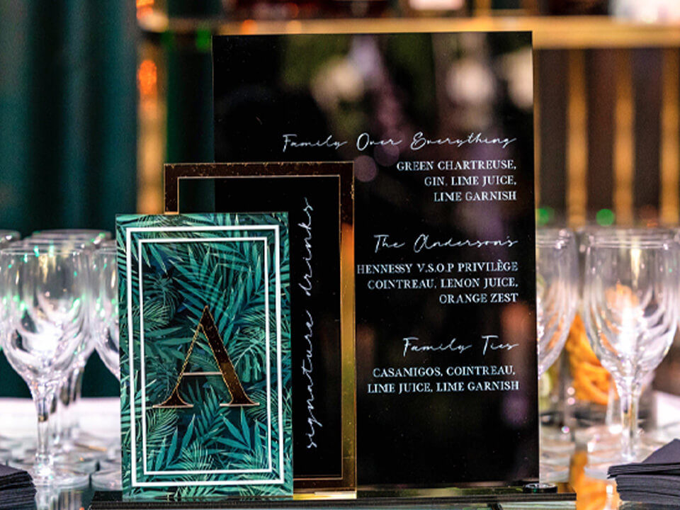 Acrylic custom-printed bar menu with the theme "Family Over Everything" 