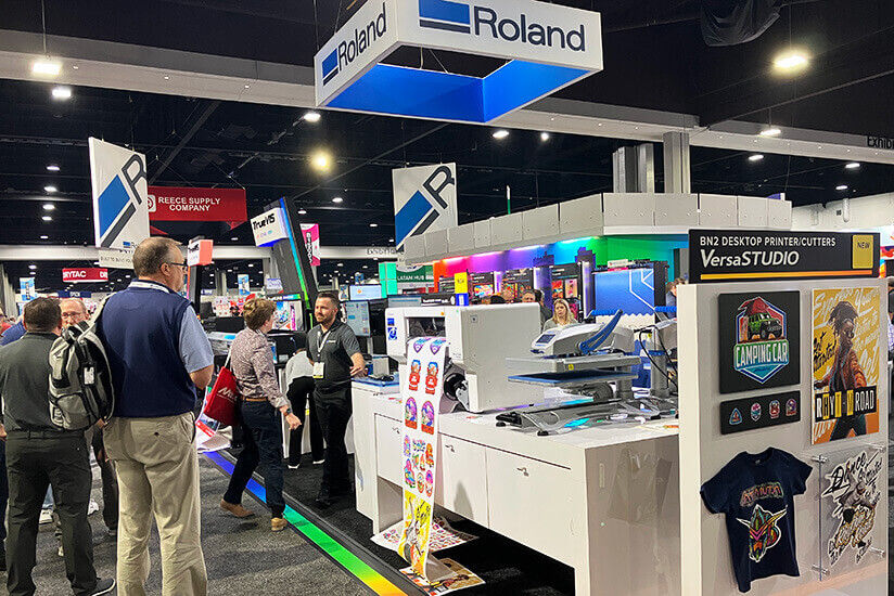 People at the Expo near the Roland DG booth