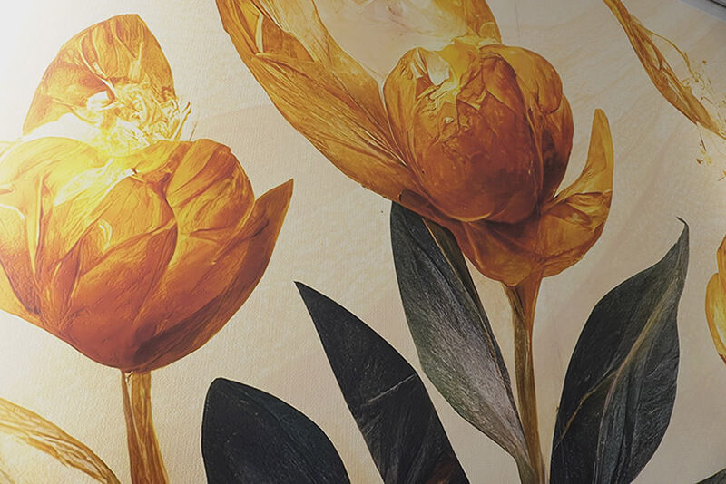 Large yellow tulips on printed wallpaper