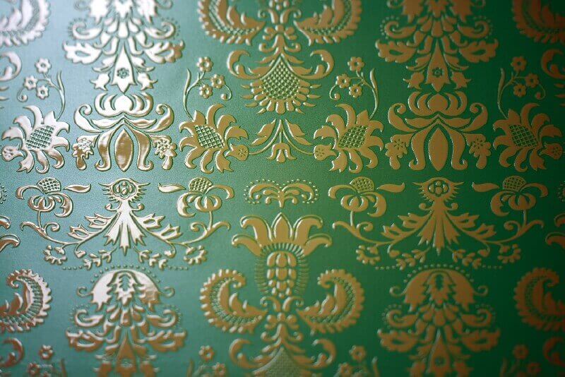 Green wallpaper with raised gold prints