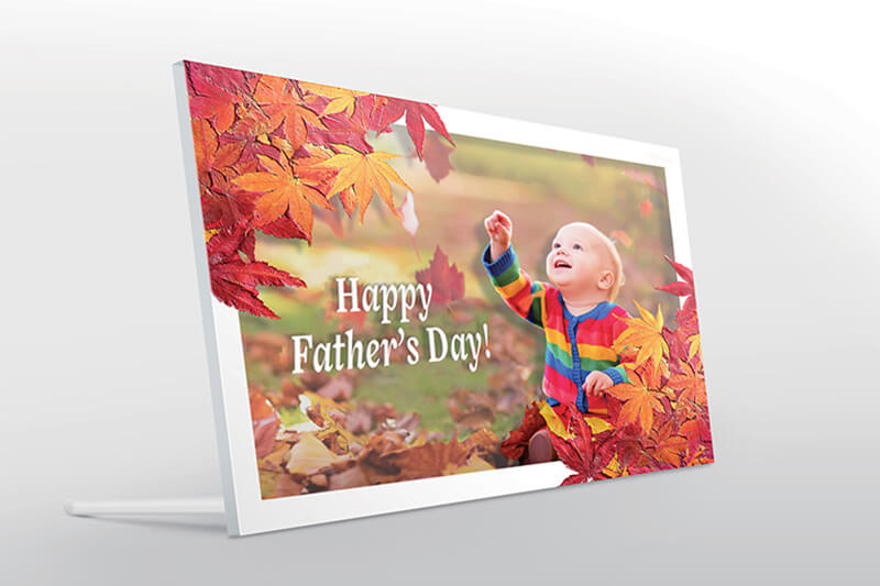 Photo frame with picture of young child and words "happy Father's Day" custom printed along with fall leaves