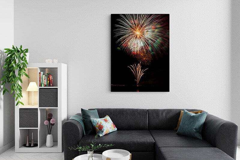 Canvas with fireworks graphic above couch