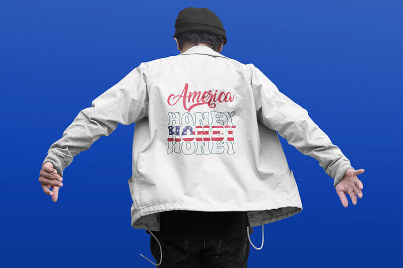 Back view of man wearing a white casual jacket with Fourth of July graphics