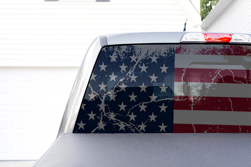 Image of Fourth of July window graphic in back window of pick up truck.