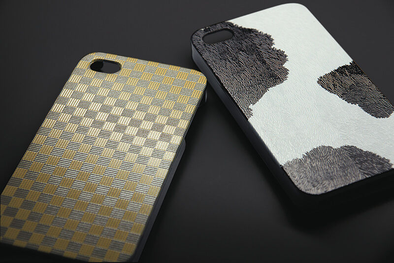 Two custom printed phone cases with textures