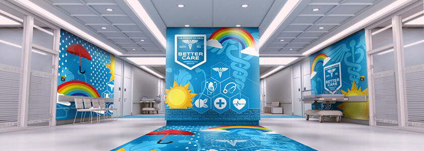 Large room with resin-ink printed blue wall graphics and a floor graphic for healthcare