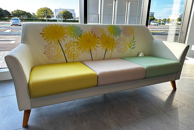 A couch printed with custom graphics in the Roland DG headquarters exhibition space.
