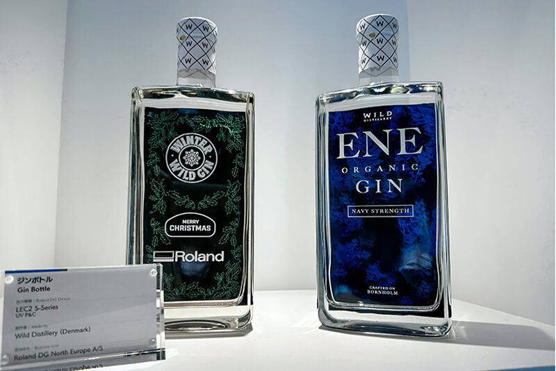 Display of two custom-printed bottles for Wild Distillery Gin.