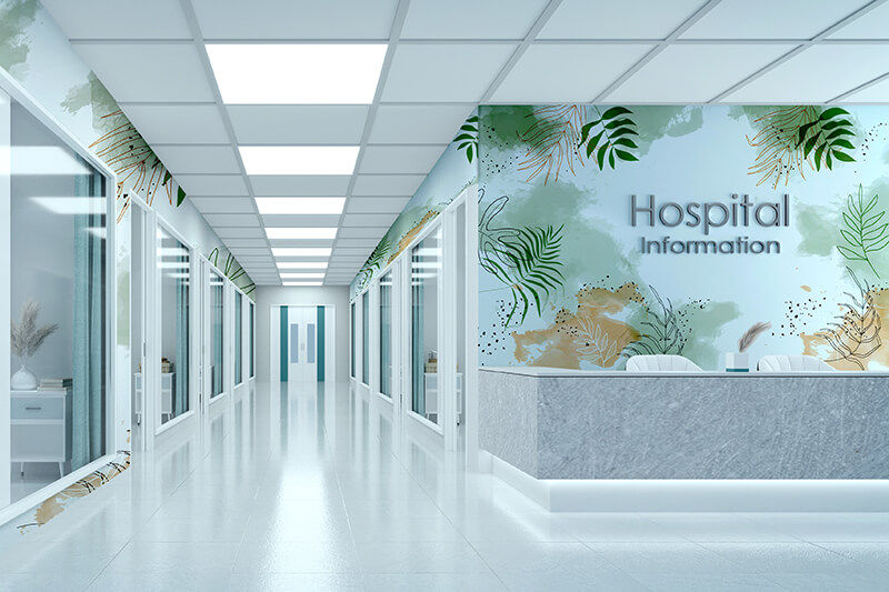 Hospital hallway with printed graphics on walls.