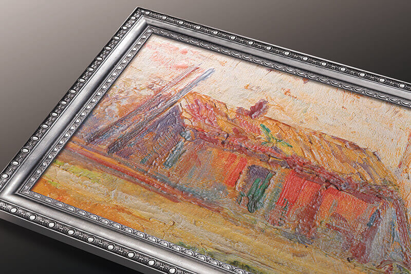 Framed art picturing a farmhouse printed with texture to imitate giclee art.