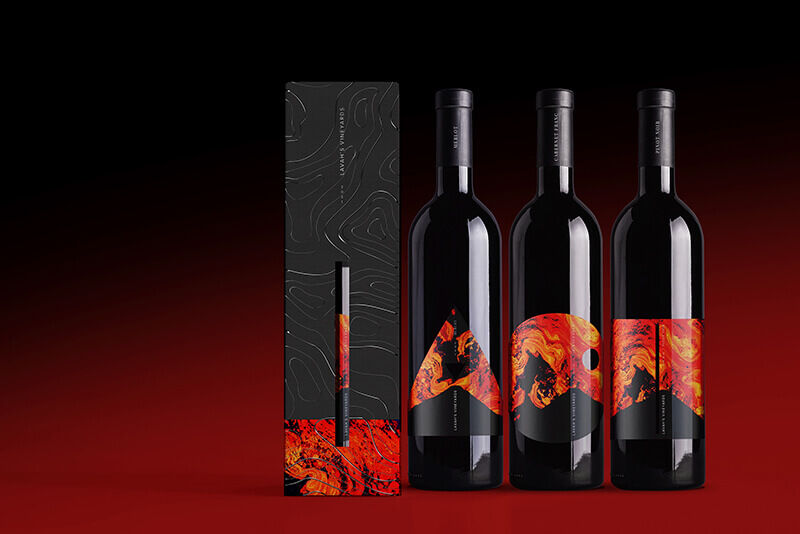 A wine box and three wine bottles, all printed with red and orange UV inks.
