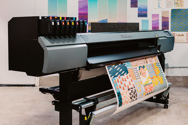 A Roland DG printer prints patterns from Bridget Thompson Studios' collection with Western Sensibility