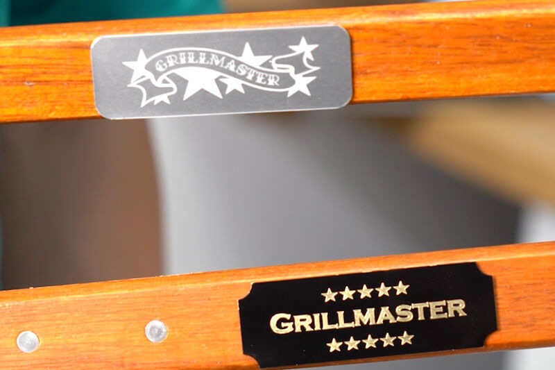Grilling tool handles with customized "Grillmaster" plates.