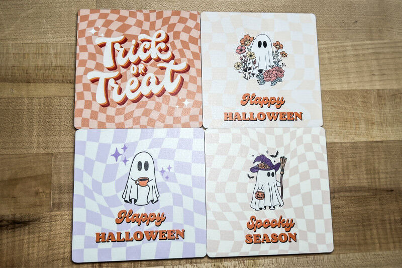 Four Halloween-themed coasters direct-printed with Roland DG's BD-8 UV printer.