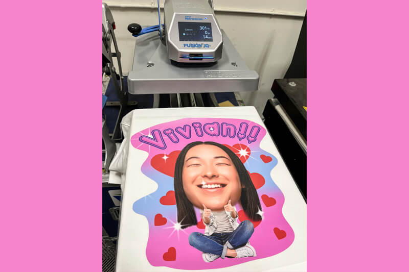 Sweater with design on heat press.