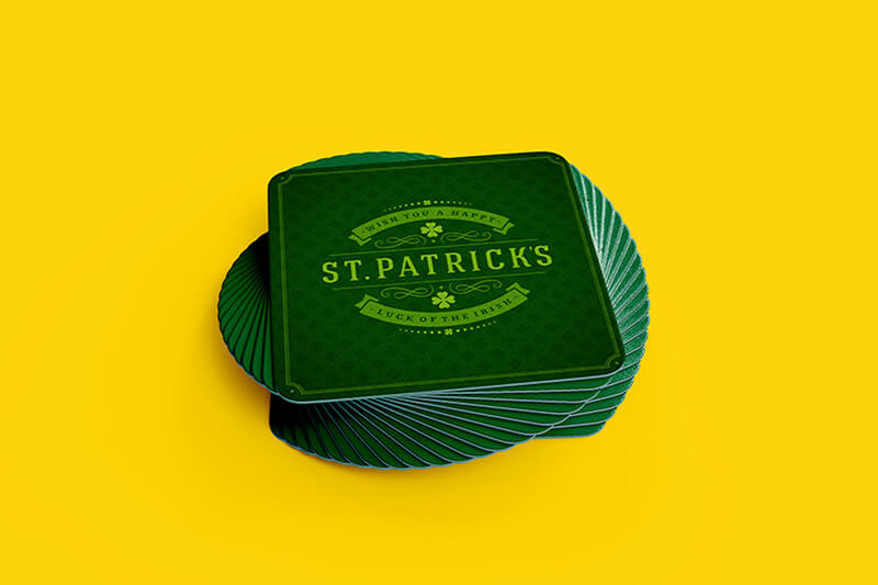 Green coasters printed with St. Patrick's and a design.