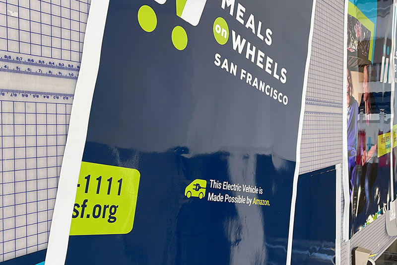 Printed vinyl panel on a worktable prior to installation on a vehicle.