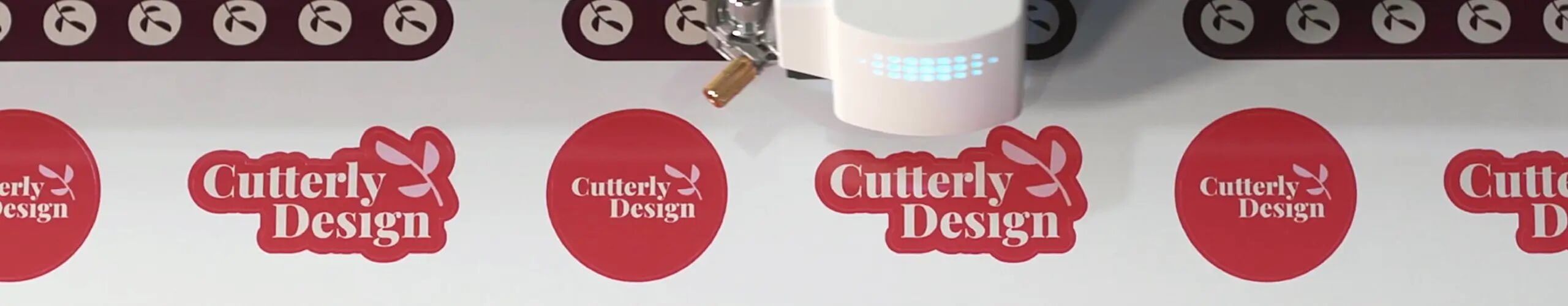 Stickers being cut on a Roland DG device.