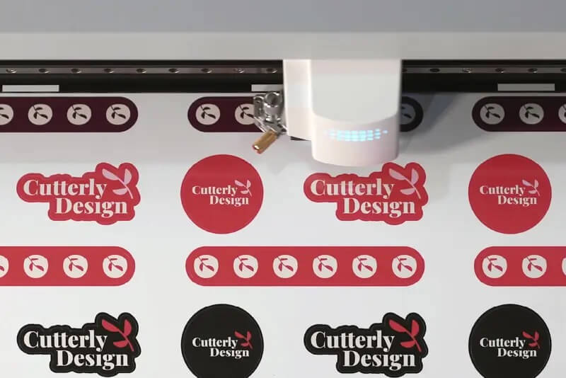 Stickers being cut on a Roland DG device.