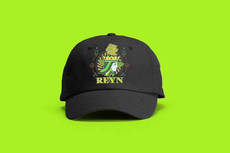 Black baseball cap with DTF-printed Reyn graphic.