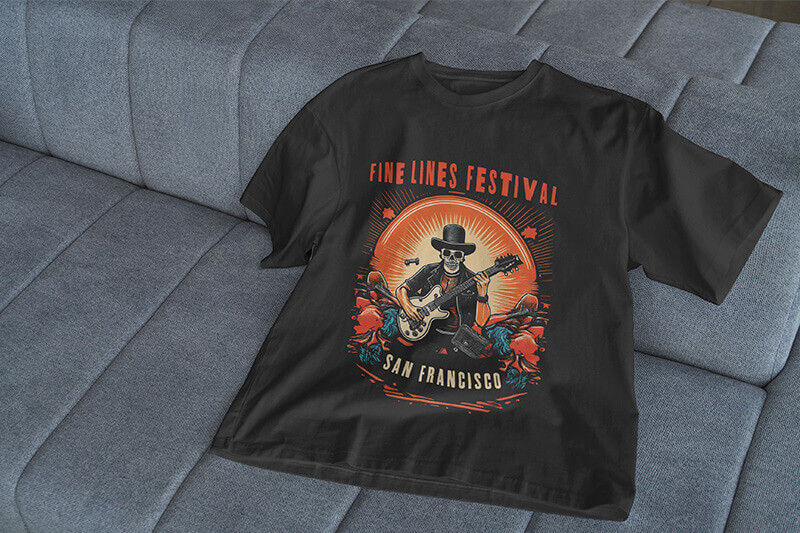 Black t-shirt with DTF-printed graphic on upholstered seat.
