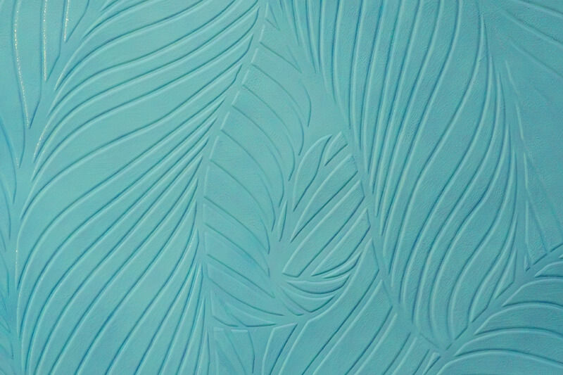 Textured teal print of leaves.
