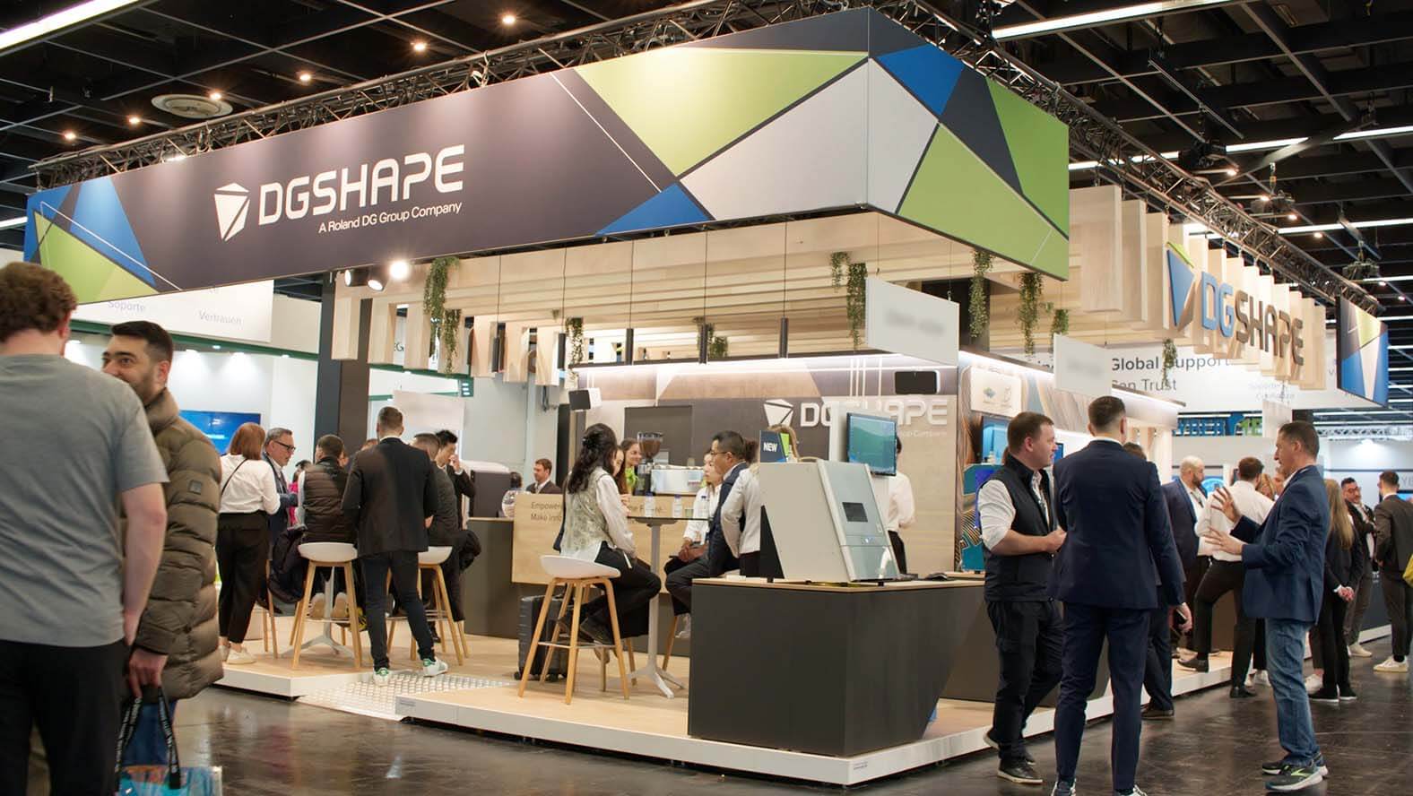 Attendees at the DGSHAPE booth at IDS.
