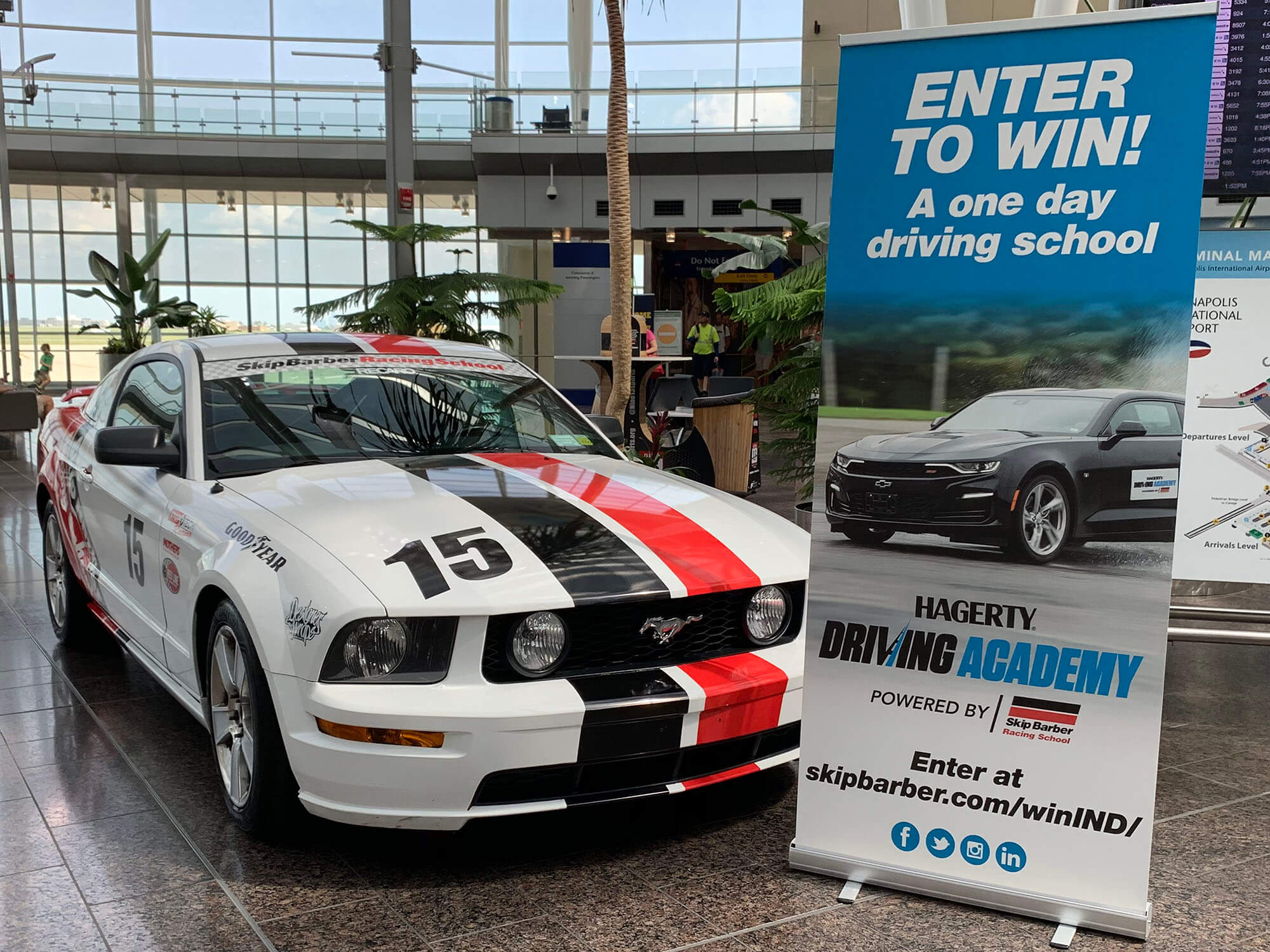 Image of vehicle wrap and sign produced by Skip Barber Racing School on a Roland TrueVIS printer/cutter.