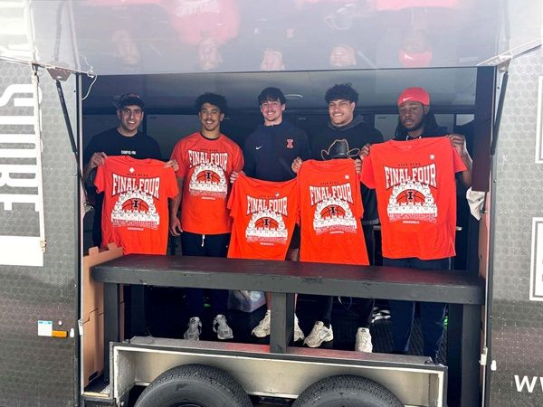 Campus Ink team with University of Illinois football players