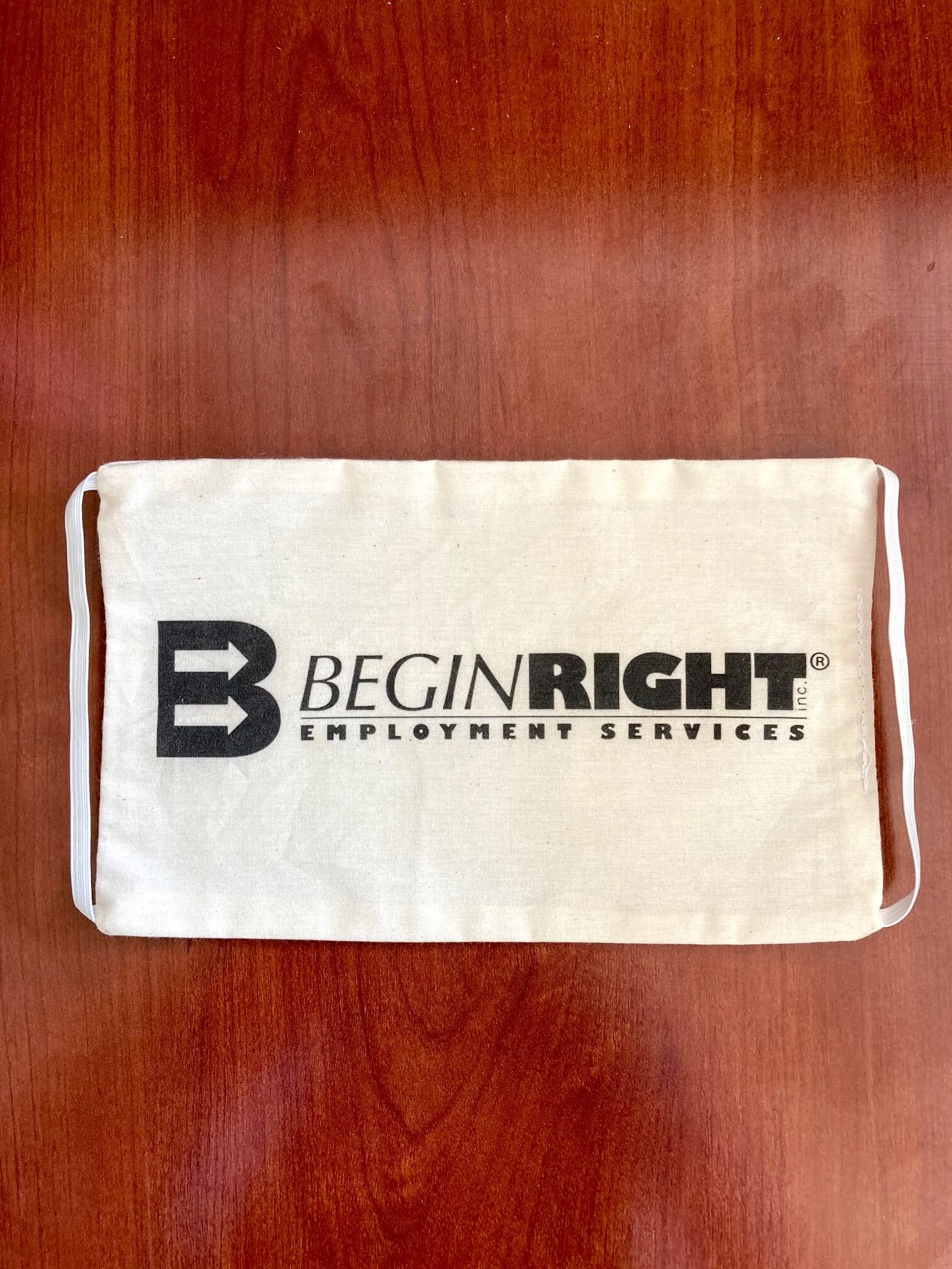 BeginRight Employment Services used its Roland DG BT-12 to print its logo on cloth masks like this one.