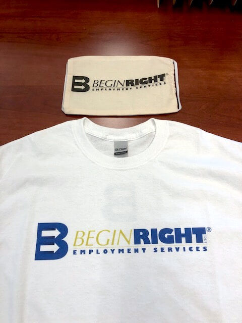 BeginRight Employment Services offers employees t-shirts and masks printed with its logo on the Roland DG BT-12 direct-to-garment printer.