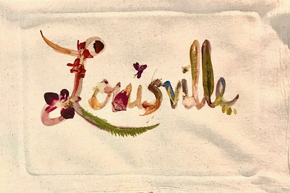 Petalos by Ada printed this tea towel with a colorful graphic of the word Louisville using a Roland DG BT-12 direct-to-garment printer