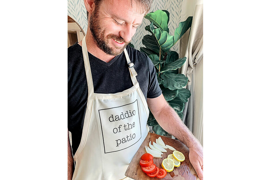 Wendy and Wander created this apron with the words Daddio of the Patio on its Roland DG BT-12 DTG printer.