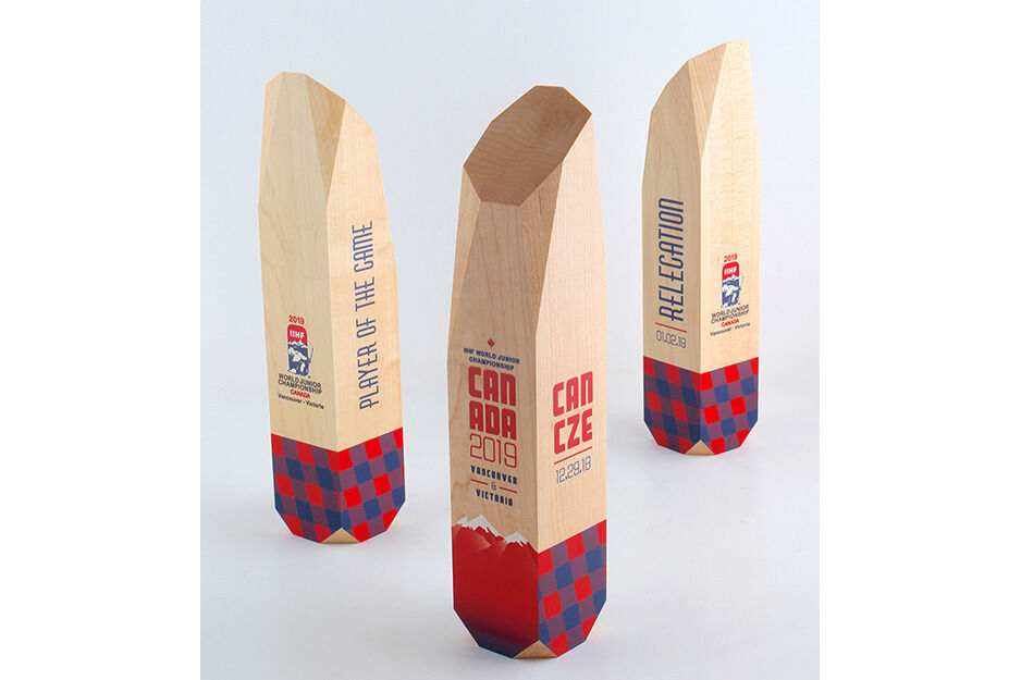 Three wooden vertical pillars - corporate awards with red and black printing