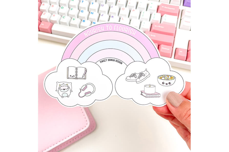 Hand holding pastel colored rainbow sticker produced on a Roland DG TrueVIS VG2 printer/cutter