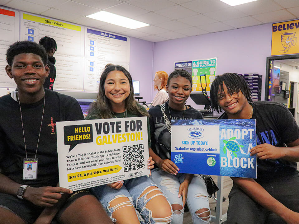 Ball HS Tor_Slider Image_Tor Store students holding signage