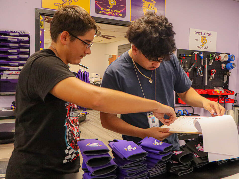 Ball HS Tor_Slider Image_Tor Store students reviewing papers