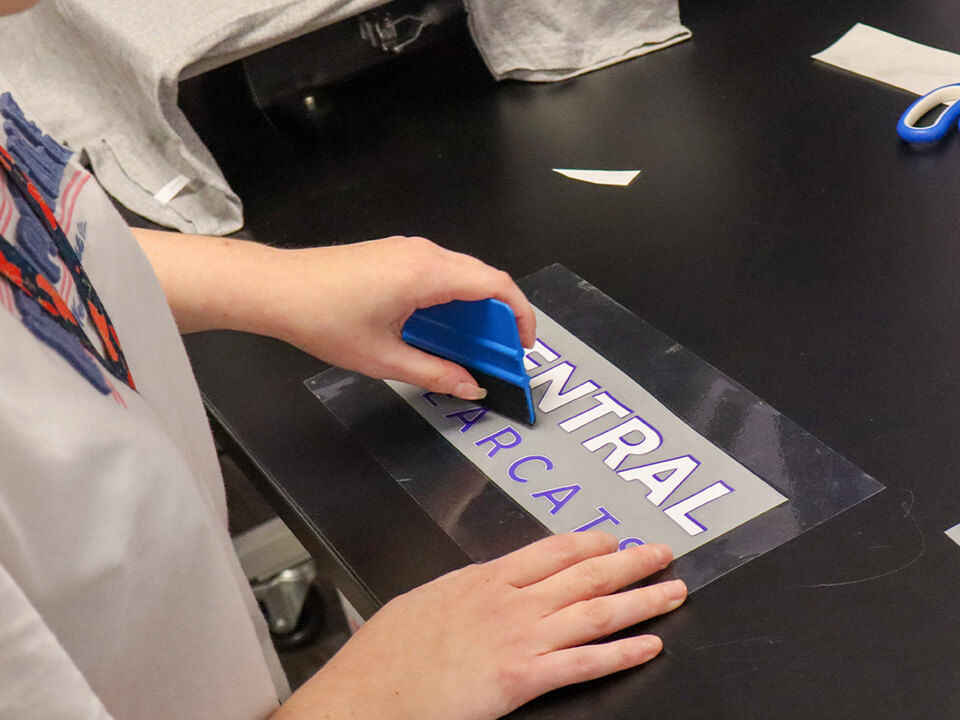 Ball HS Tor_Slider Image_Tor Store student working on signage.