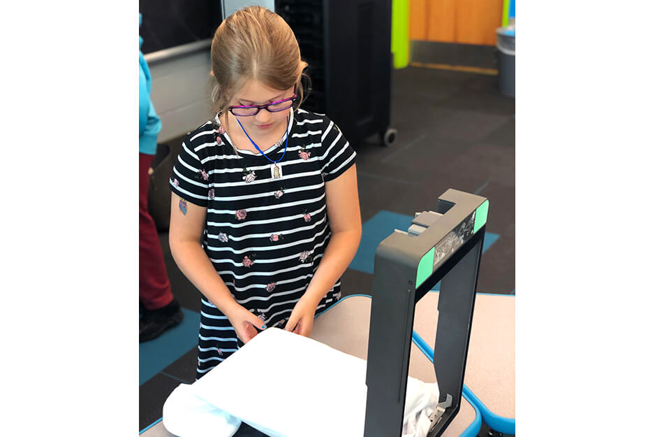 Burrell Elementary students helped print their t-shirts on the easy-to-use Roland BT-12 direct-to-garment printer