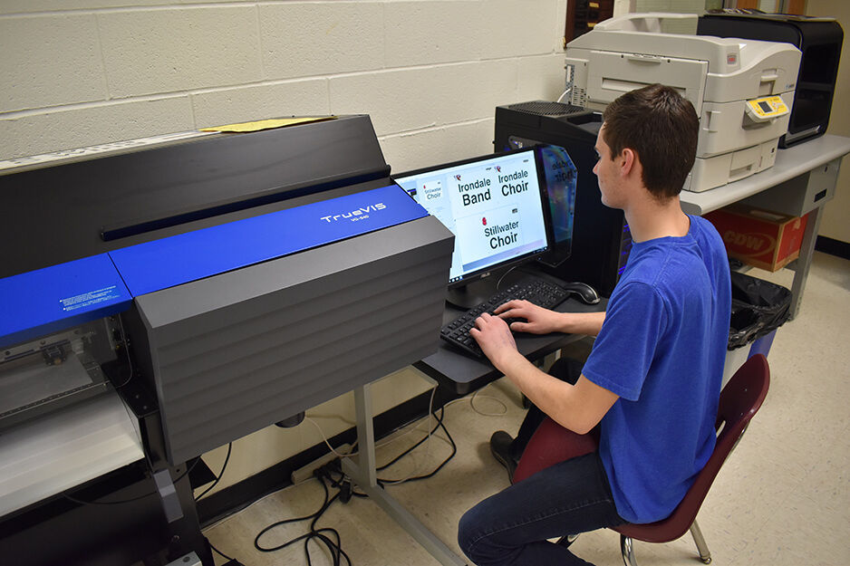 A Roseville student works on designs that will be printed on the Roland TrueVIS VG2 digital printer/cutter