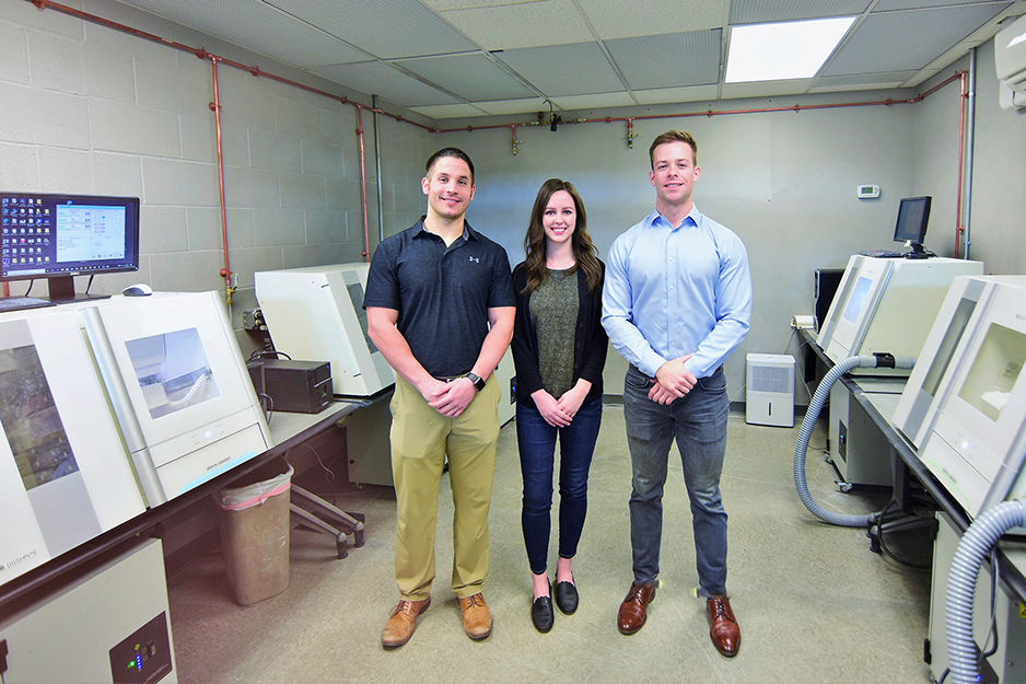 Maverick Dental Laboratories' staff in their production facility with their Roland DGSHAPE dental milling machines.