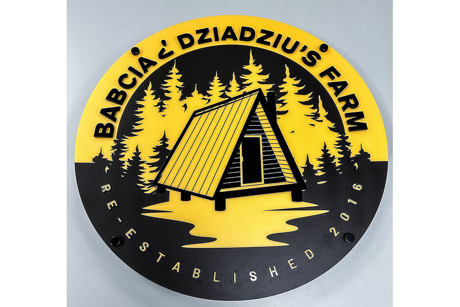 Black and yellow round sign for Babcia Dziadziu's Farm