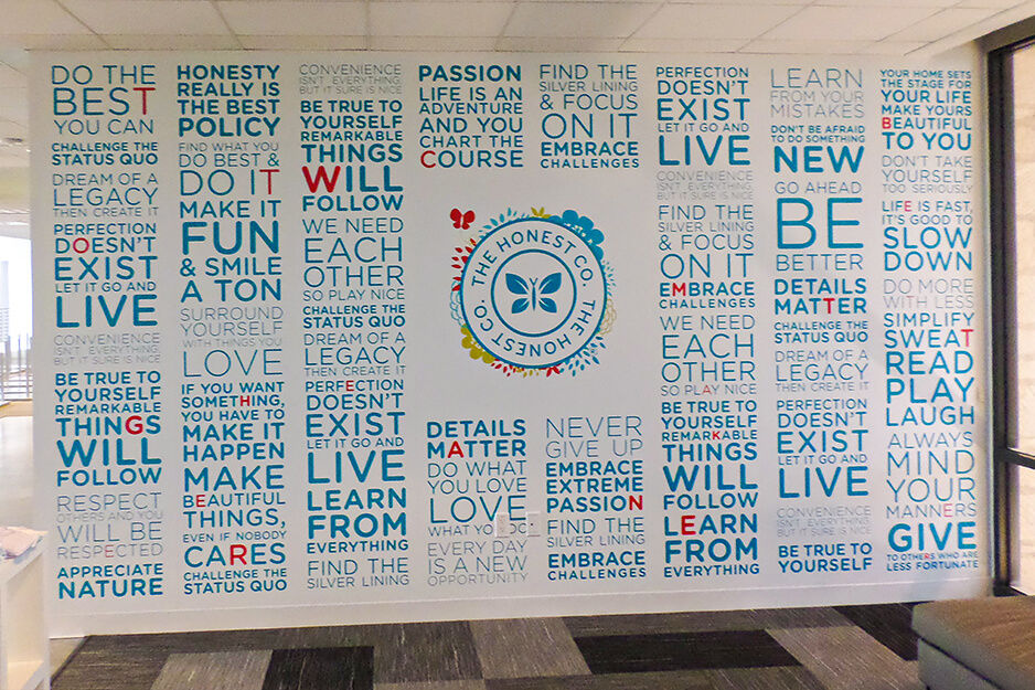 Light blue typographic wall graphics for Honest Company printed on a Roland DG wide-format printer/cutter