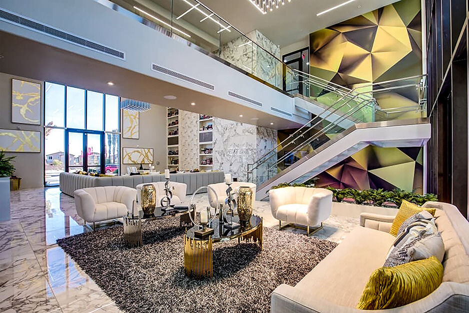 Corporate lobby with colorful two-story wall graphics printed using a Roland DG wide-format printer/cutter.