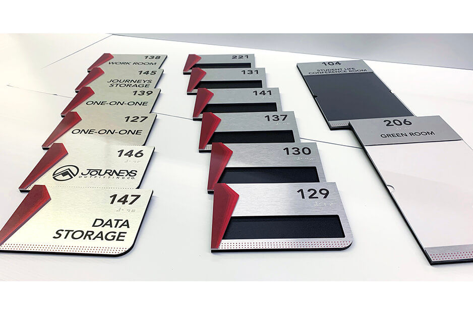 Advanced Sign uses its Roland DG VersaUV flatbed printers to print ADA compliant room labeling signage.