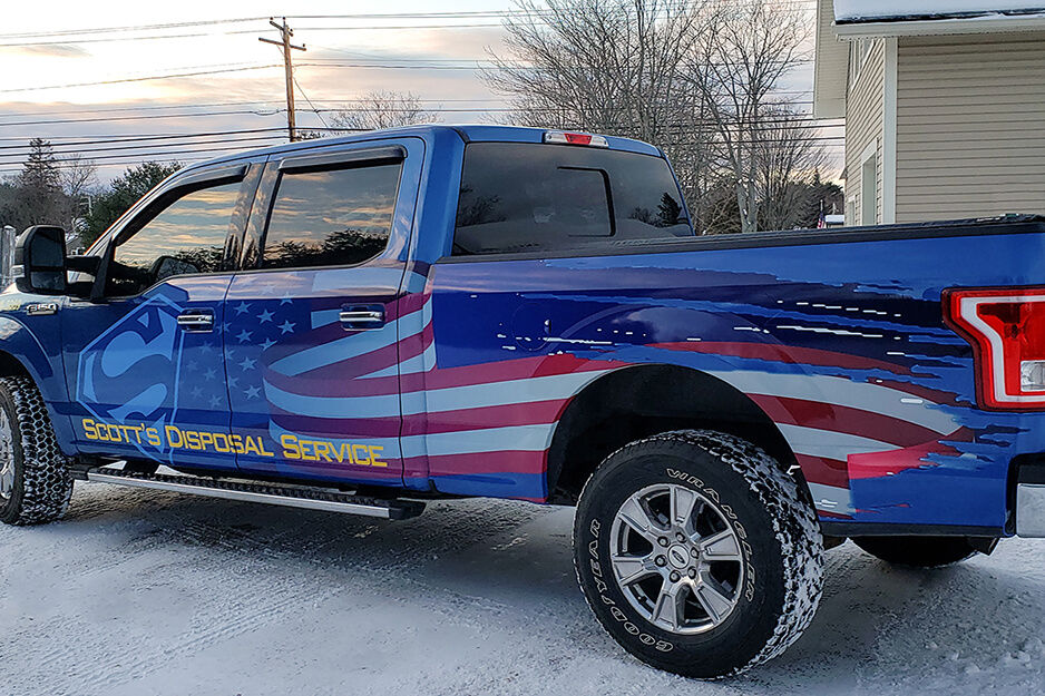 Blue pick-up truck sports patriotic graphics produced on a Roland DG TrueVIS VG2 wide-format printer/cutter.