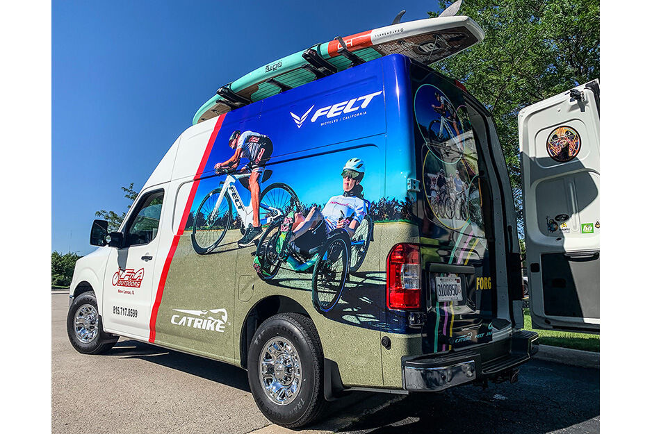 Van with back door open and colorful graphics